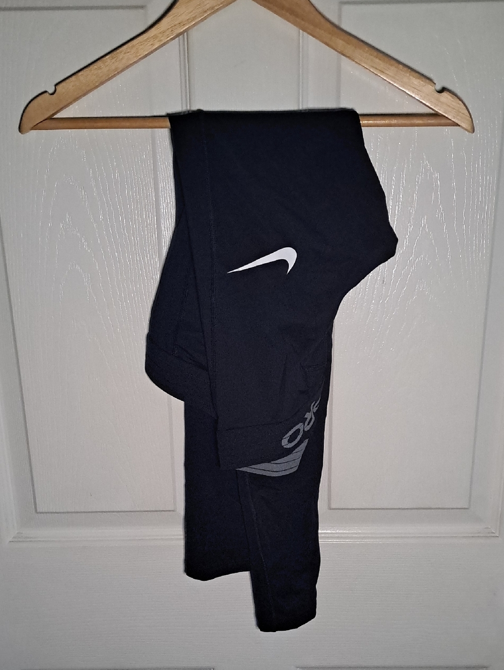 Nike Kids Black Athletic Leggings with White Swoosh